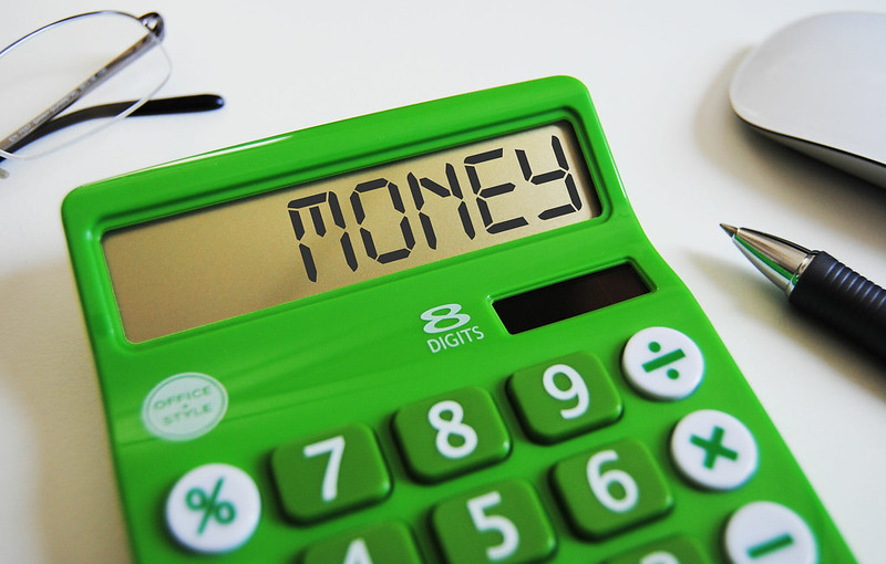 The word money written on a calculator's display